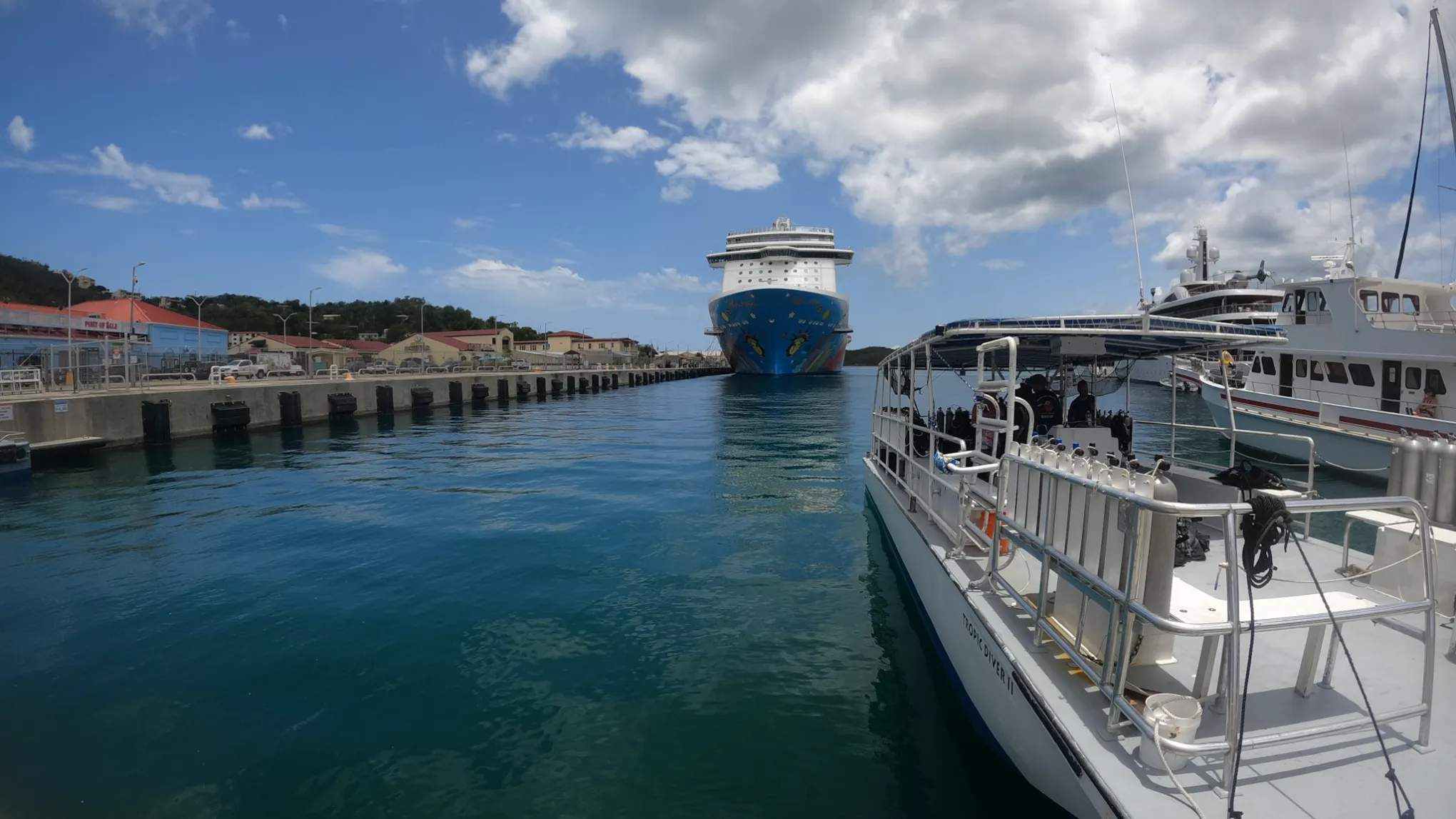 a boat is docked next to a body of water