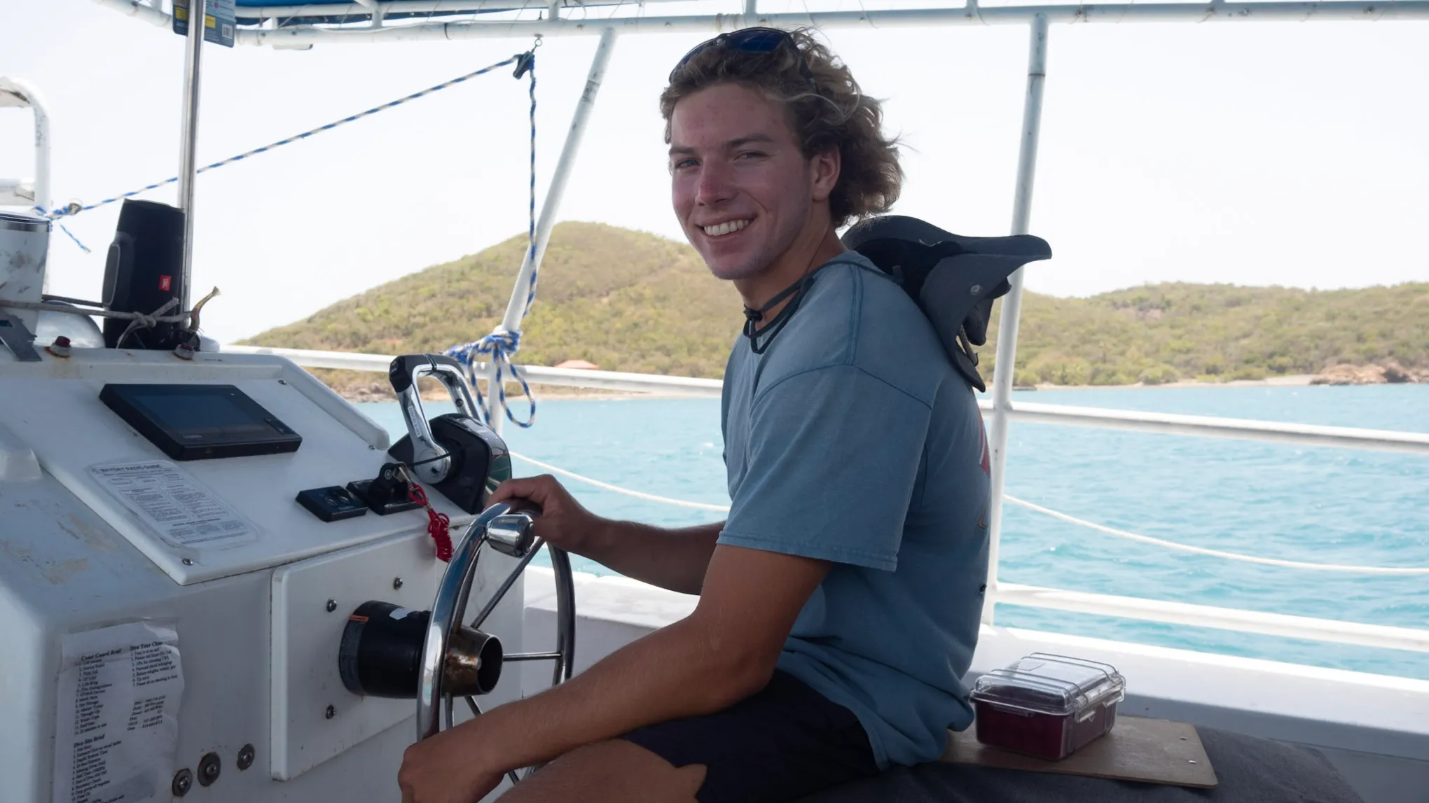 a man standing in front of a boat