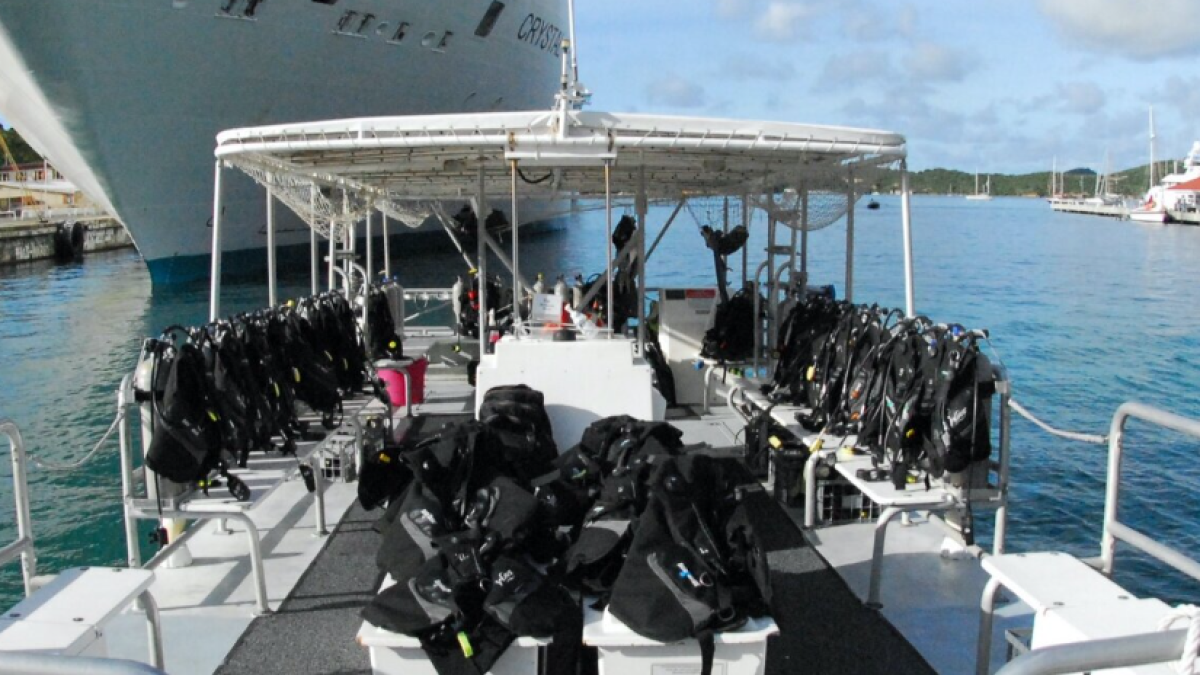 a boat is docked next to a body of water