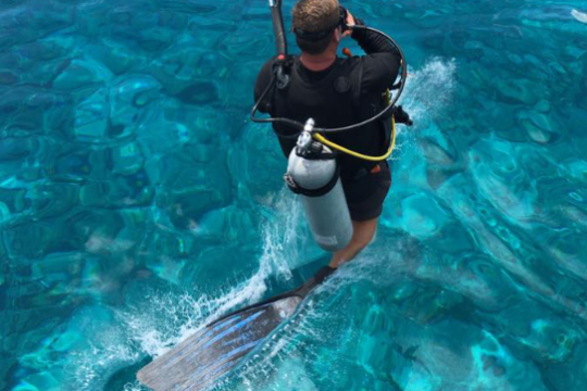 a man swimming in a pool of water